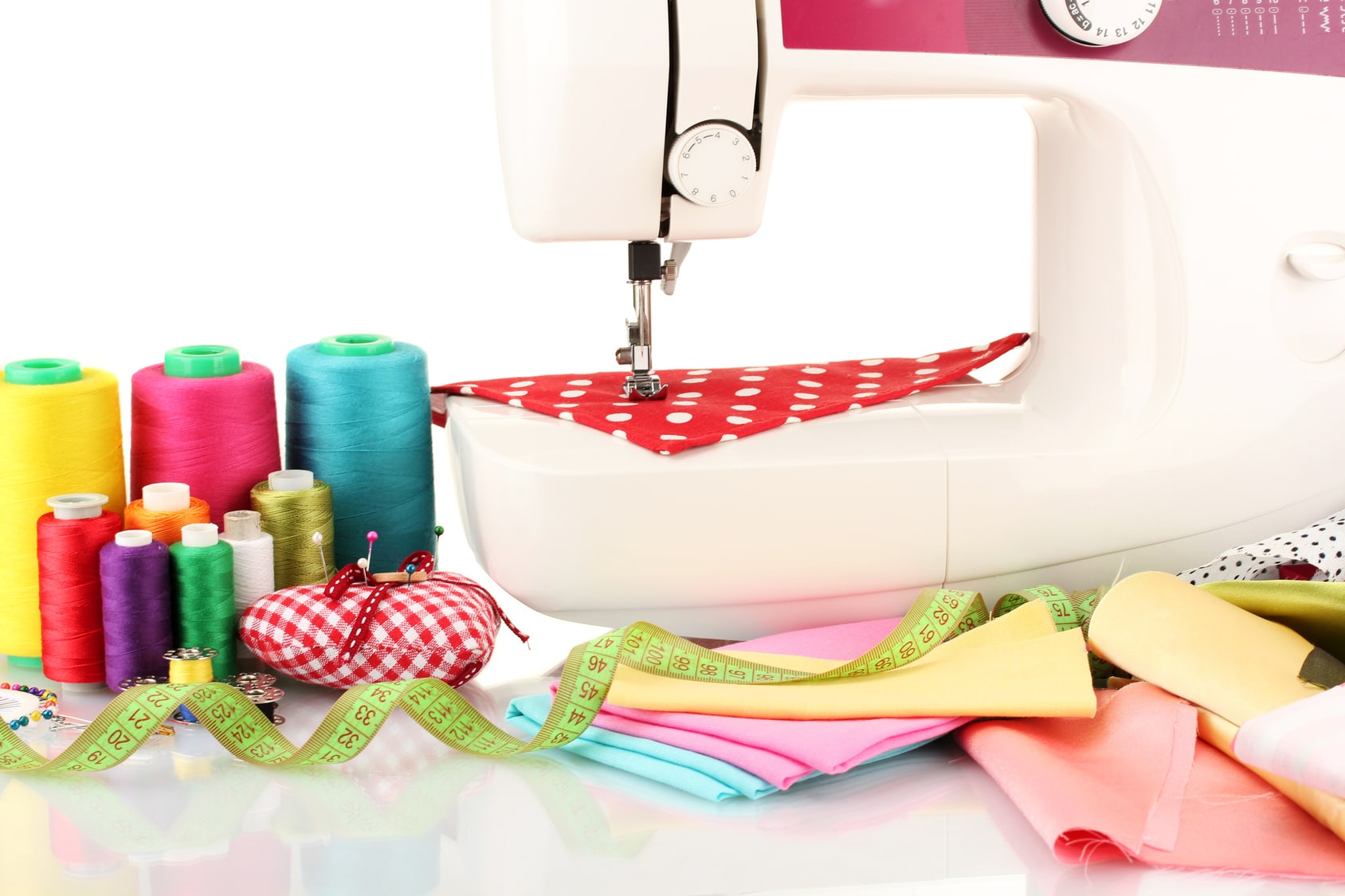 sewing machine and fabric isolated on white sewing machine and fabric isolated on white
